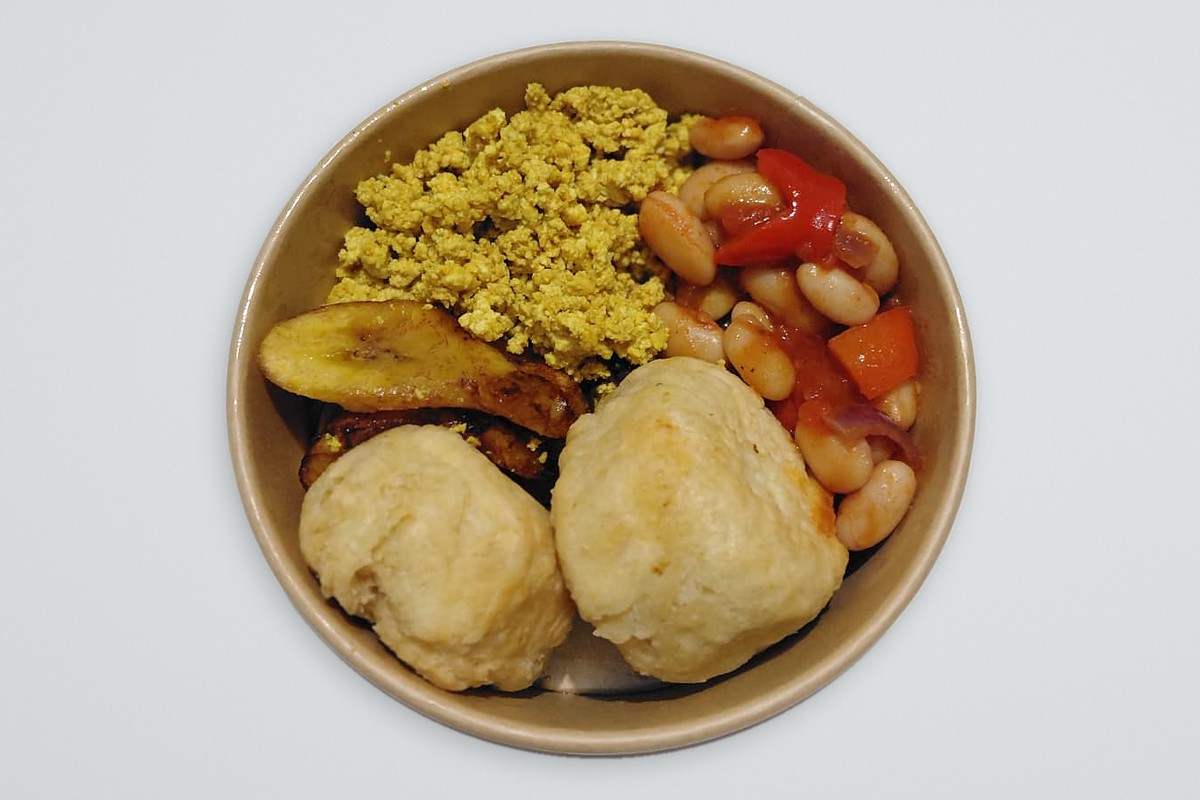Rooted Soul vegan breakfast: scrambled tofu, smoky beans, fried plantain and two dumplings